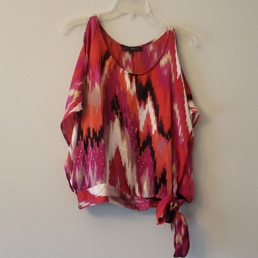 Dolloman multi-colored top with tie accent. 